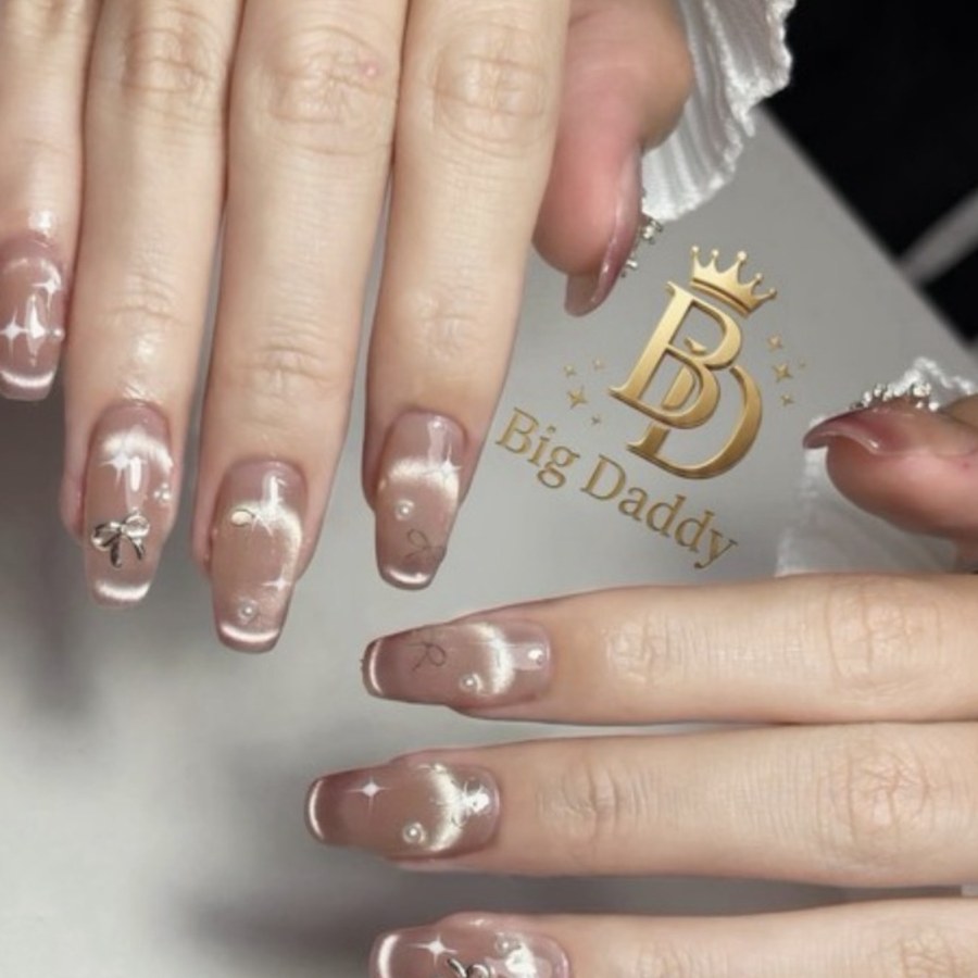 Gel nail extensions with charms